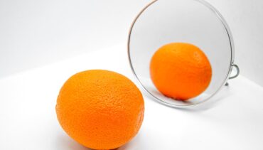 orange in front of mirror
