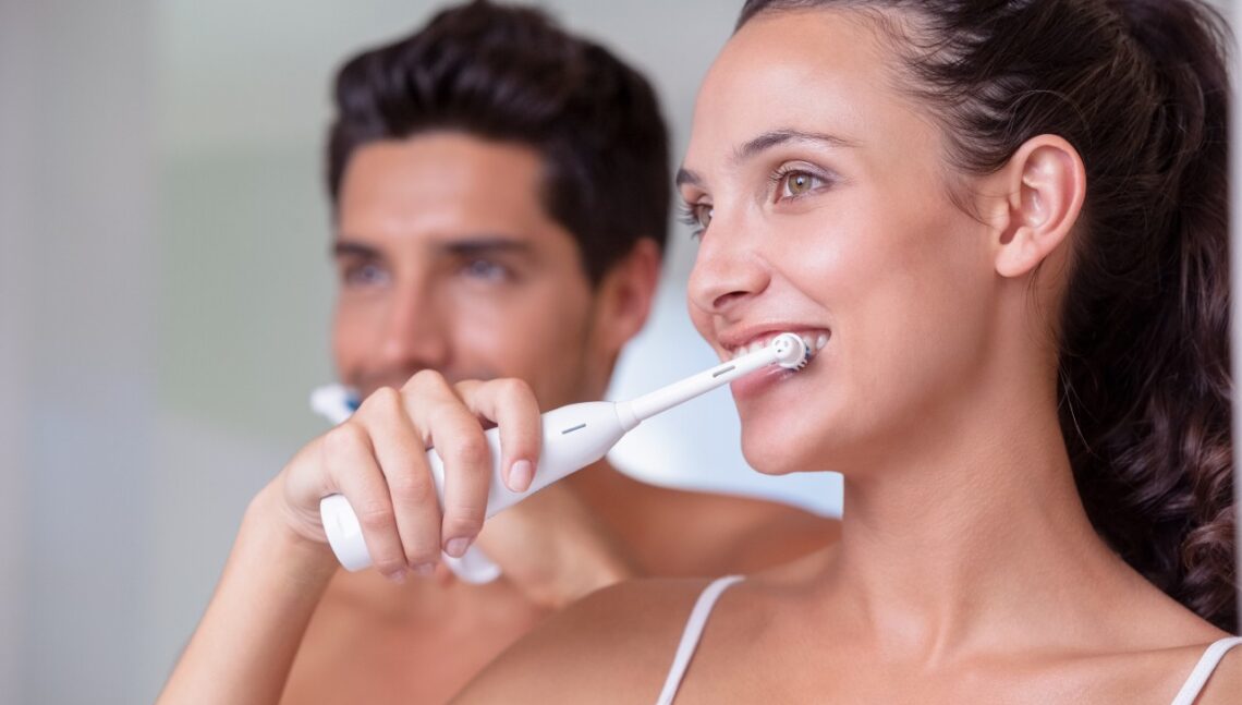 couple brushes teeth